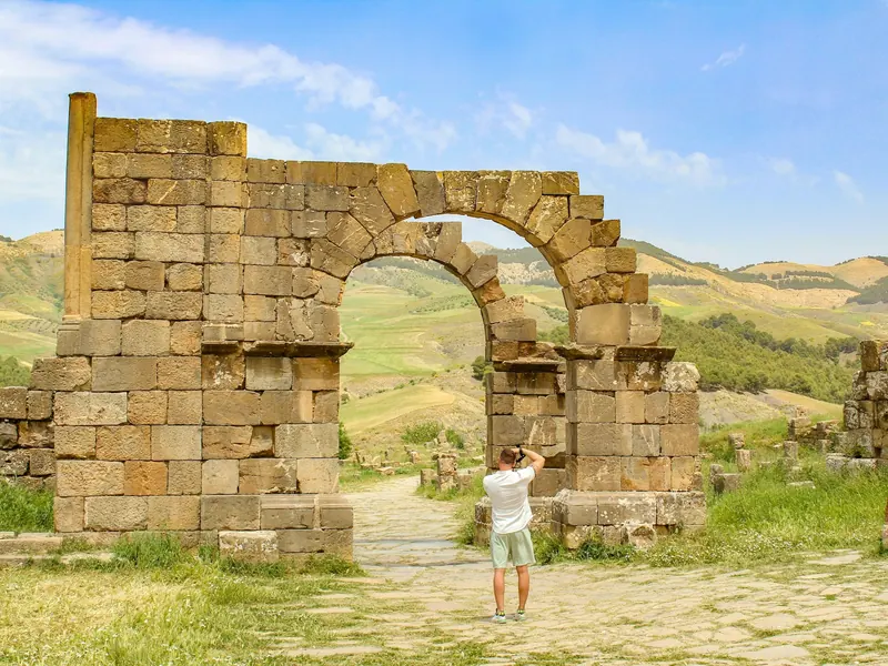 A Roman arch in the green hills of Djemila