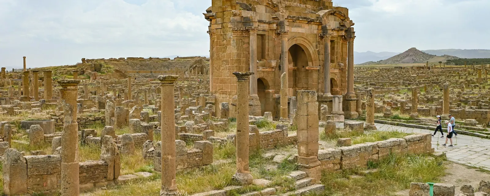 The Arch of Trajan and colonnaded streets of Timgad